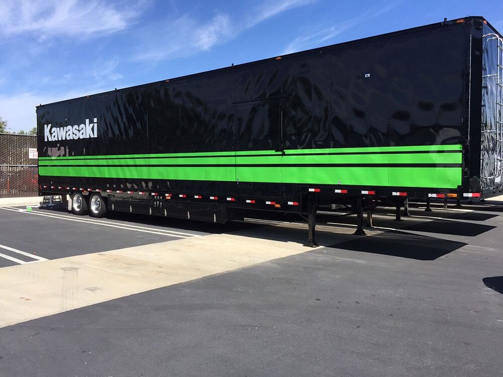 Kawasaki's black and green trailer vehicle wrap
